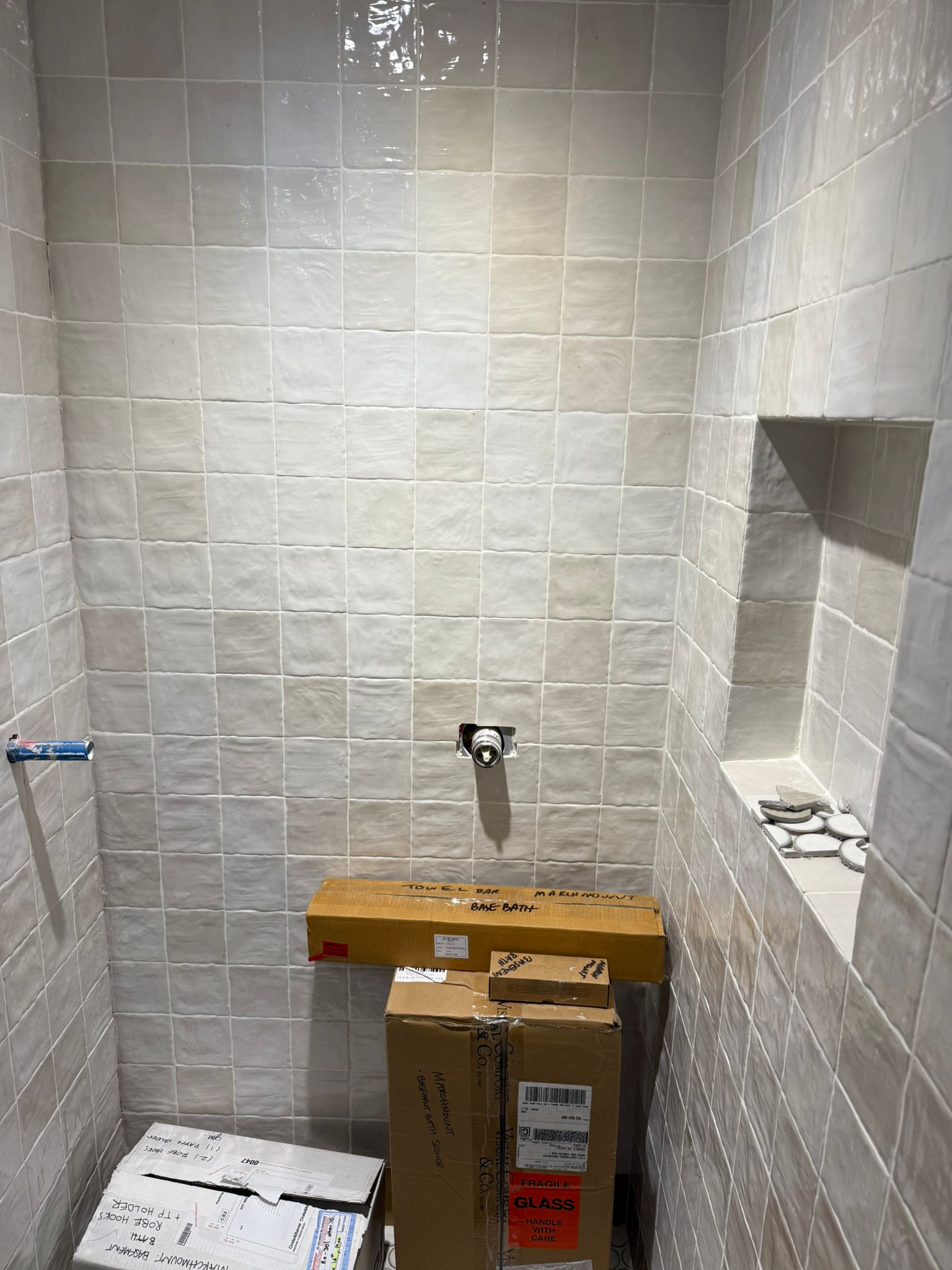 Handmade-look shower tile with a niche detail